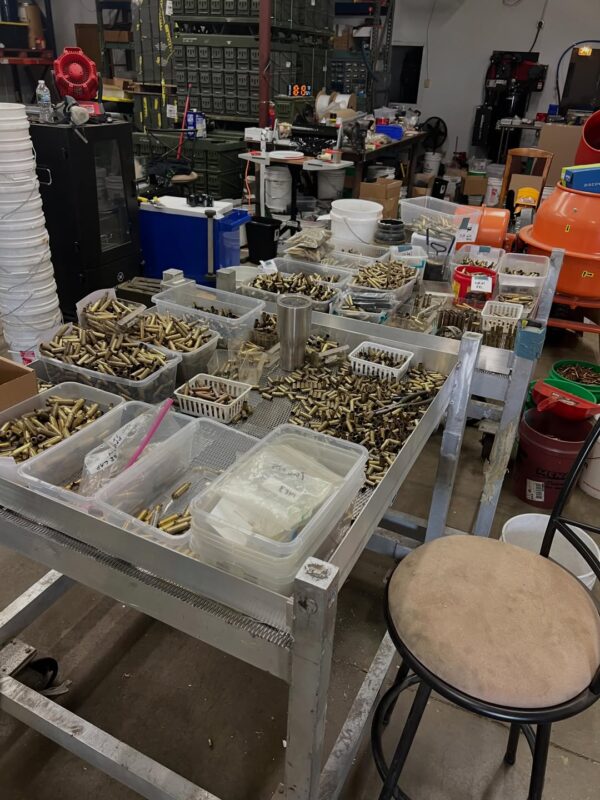Sorted once-fired brass on custom sorting carts in the Charlie Mike's Armory workshop in Romeoville, Illinois
